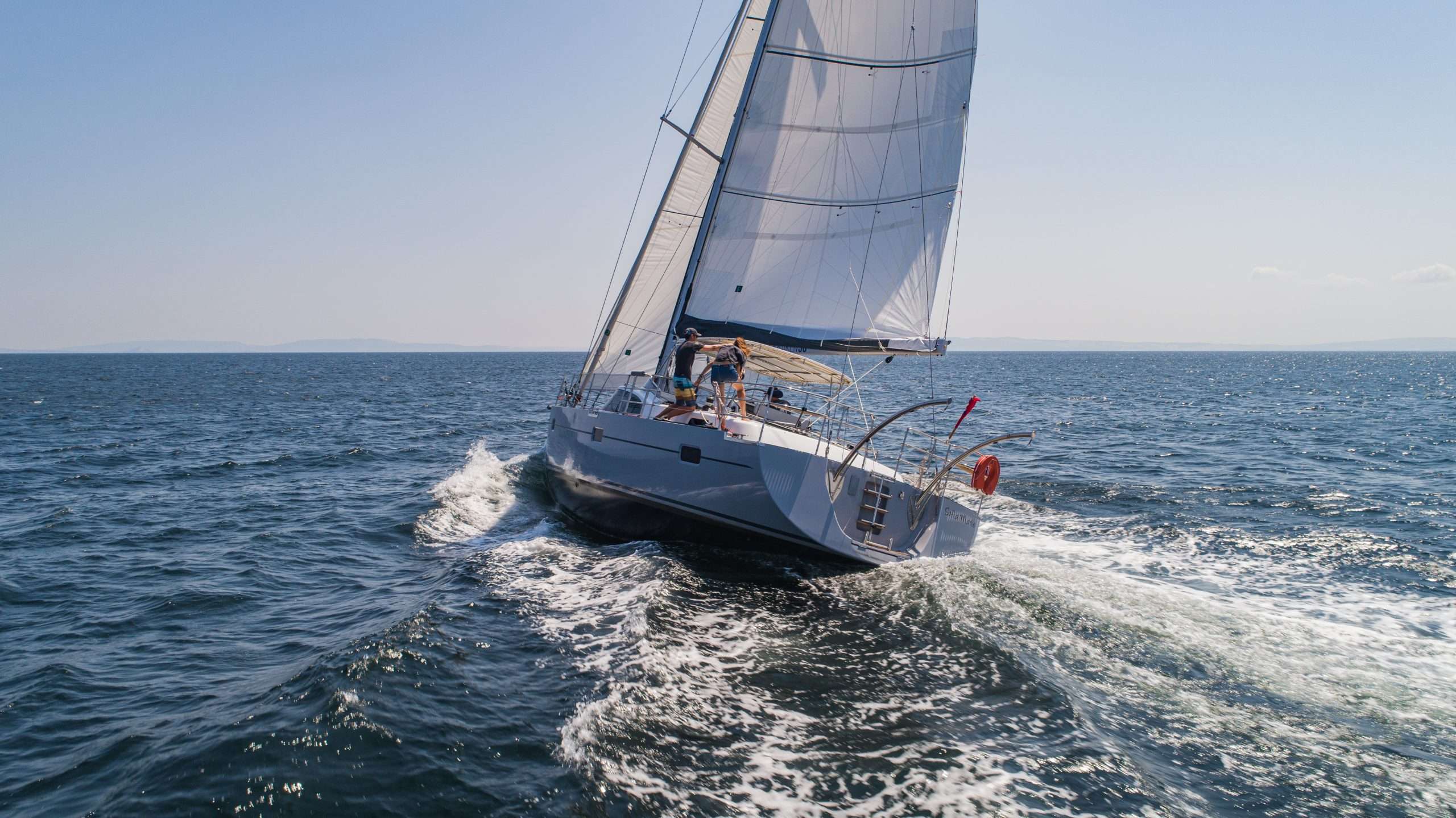 Aerial view of a Kraken 50 sailing yacht under way on open blue water